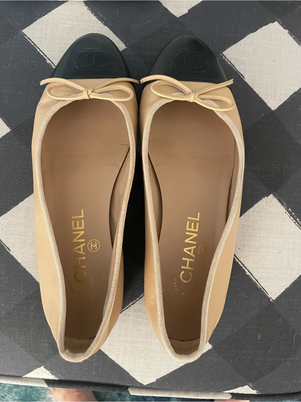 CHANEL Beige Leather Ballet Flats with Black Cap Toe and Bow